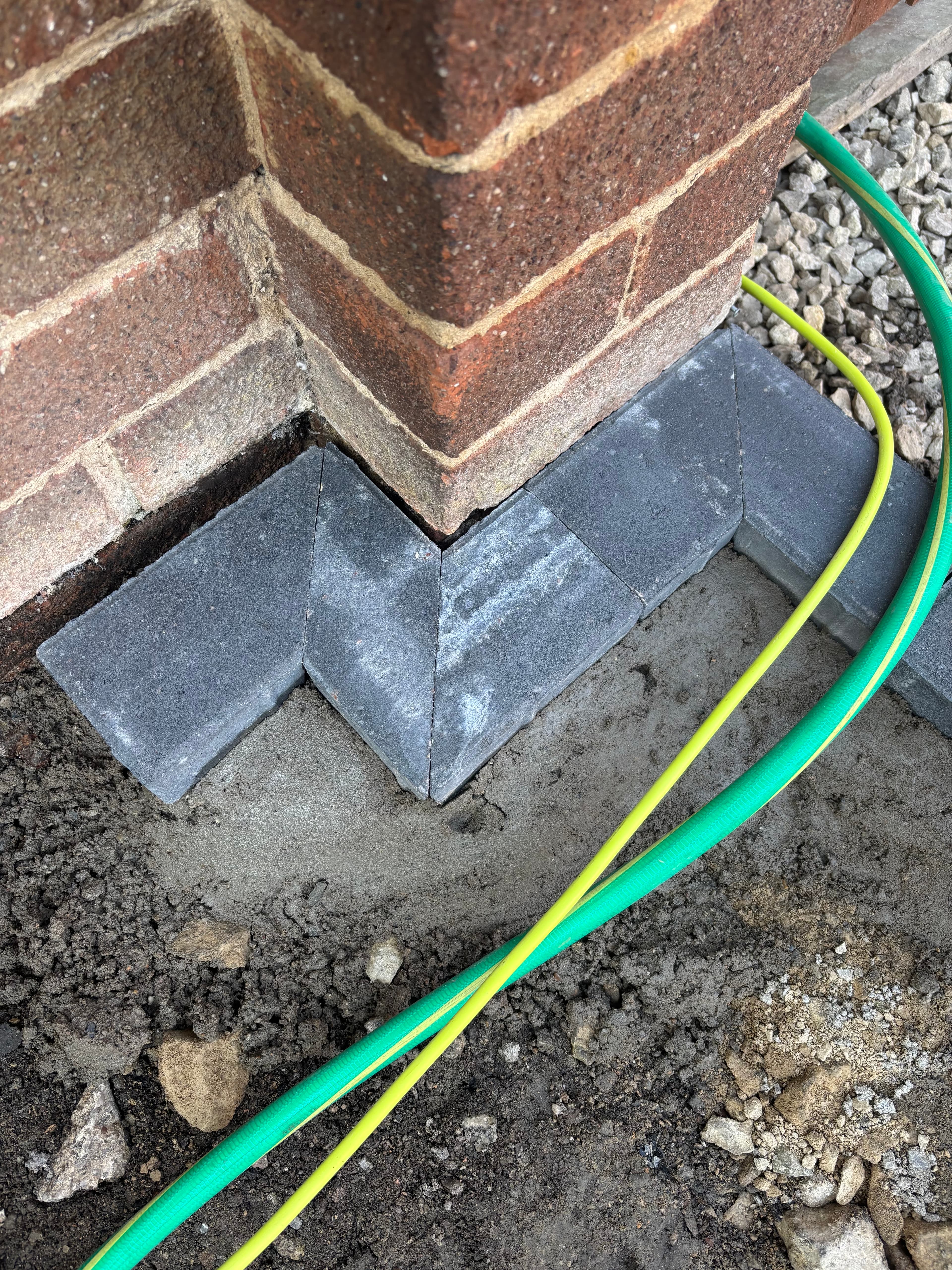 Three separate patio areas connected by stepping stone slabs