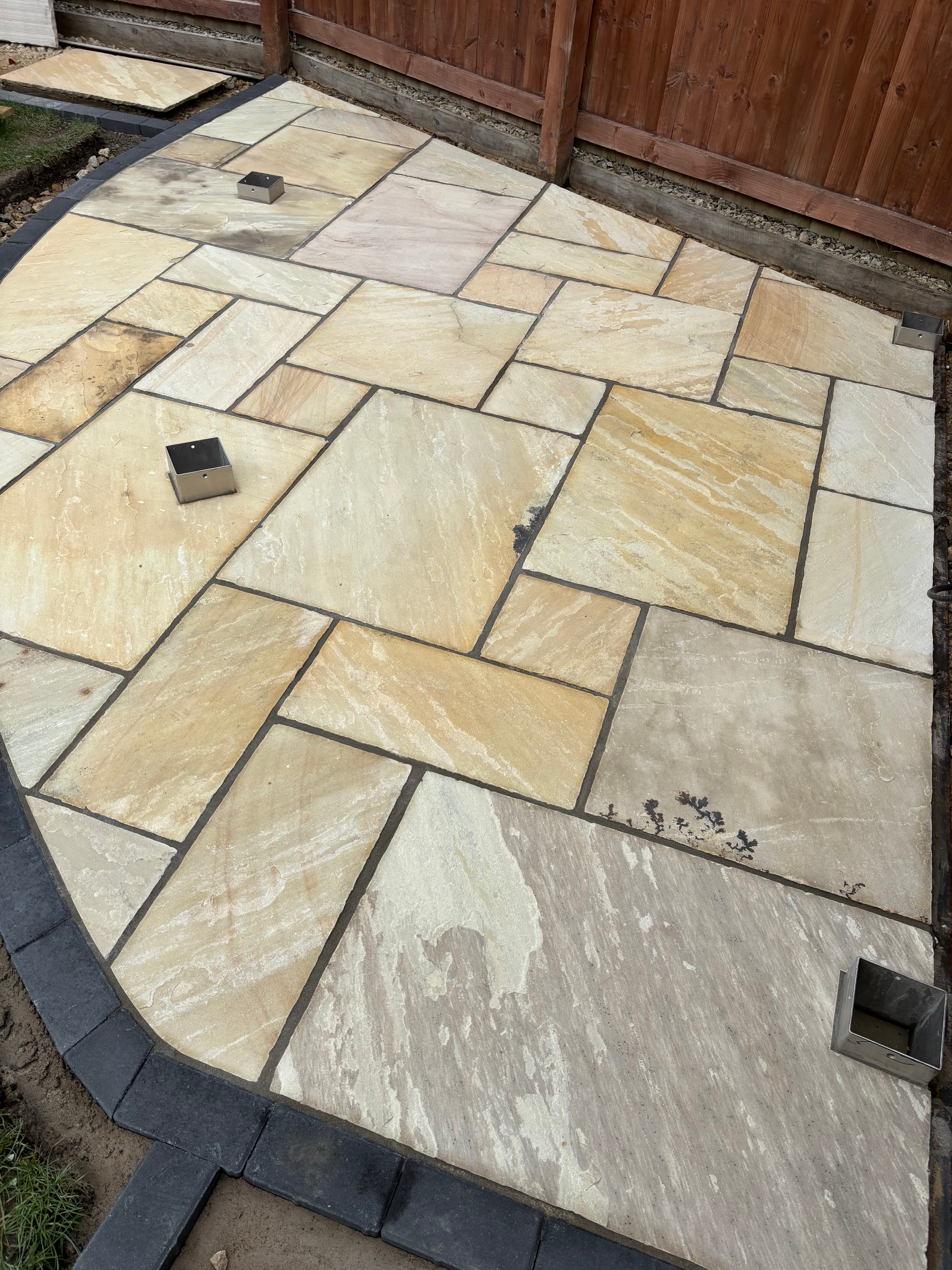 Stepping stone slabs providing access between the three patio areas