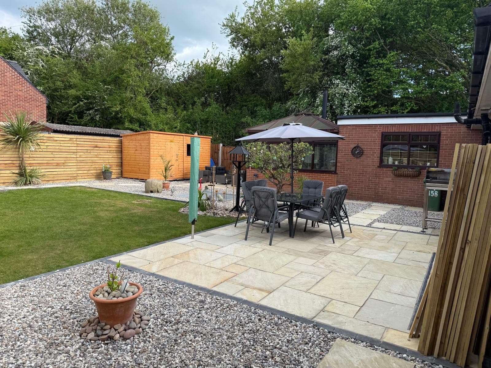 Full rear garden transformation with three patios and decorative gravel