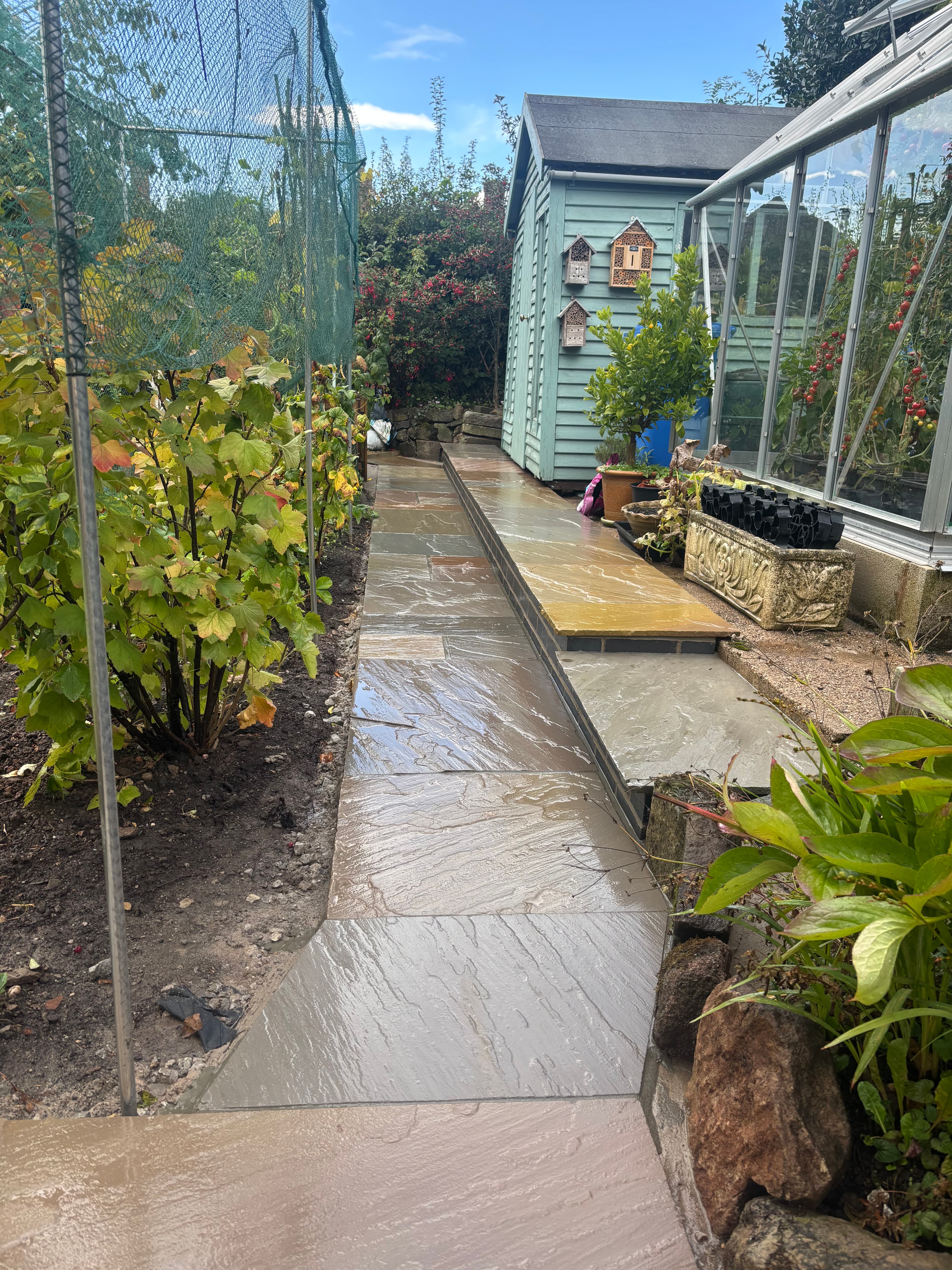 Marshall's brick border installed around the flower beds