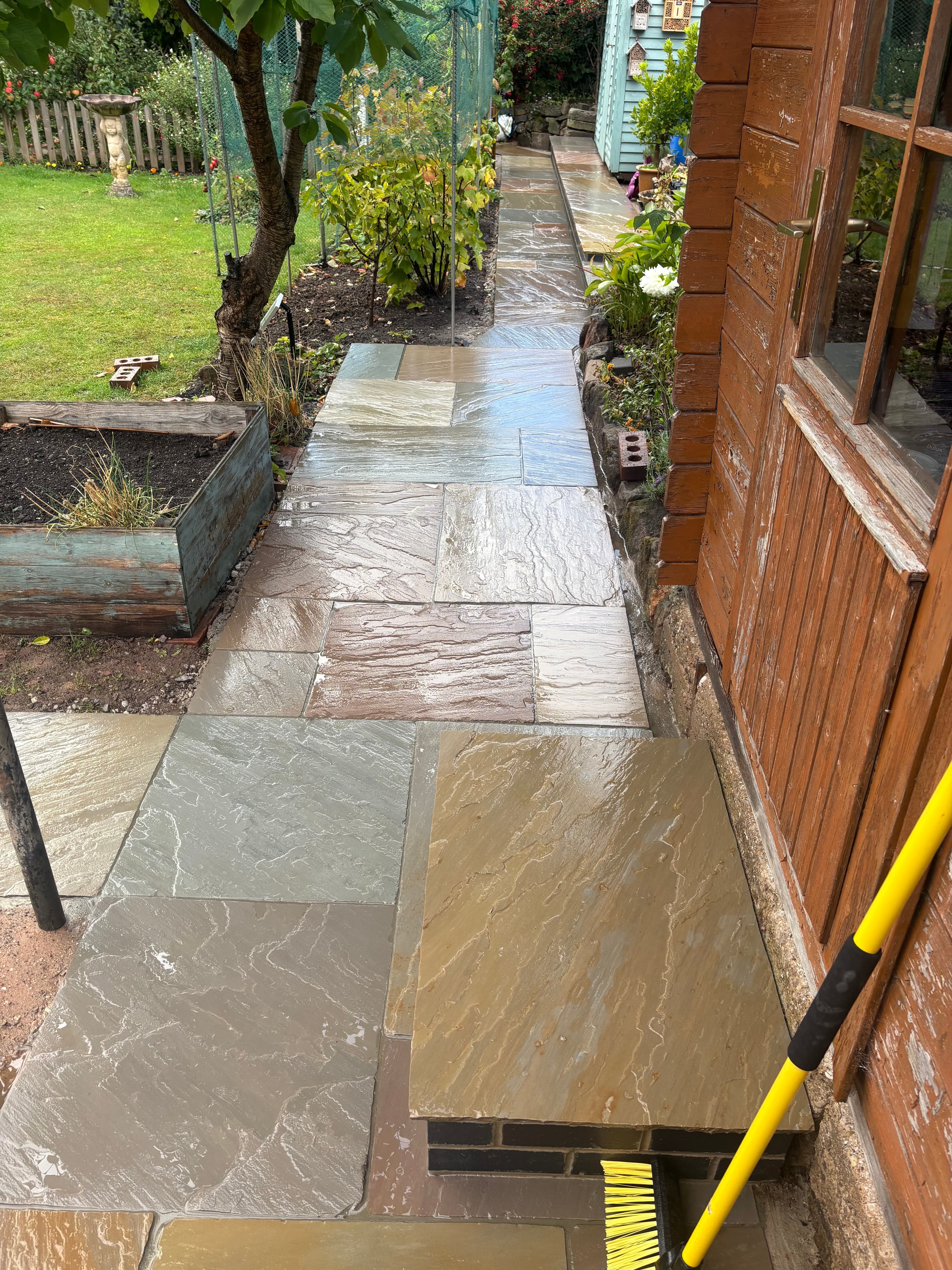 Completed path running from the house to the sheds with new turf alongside