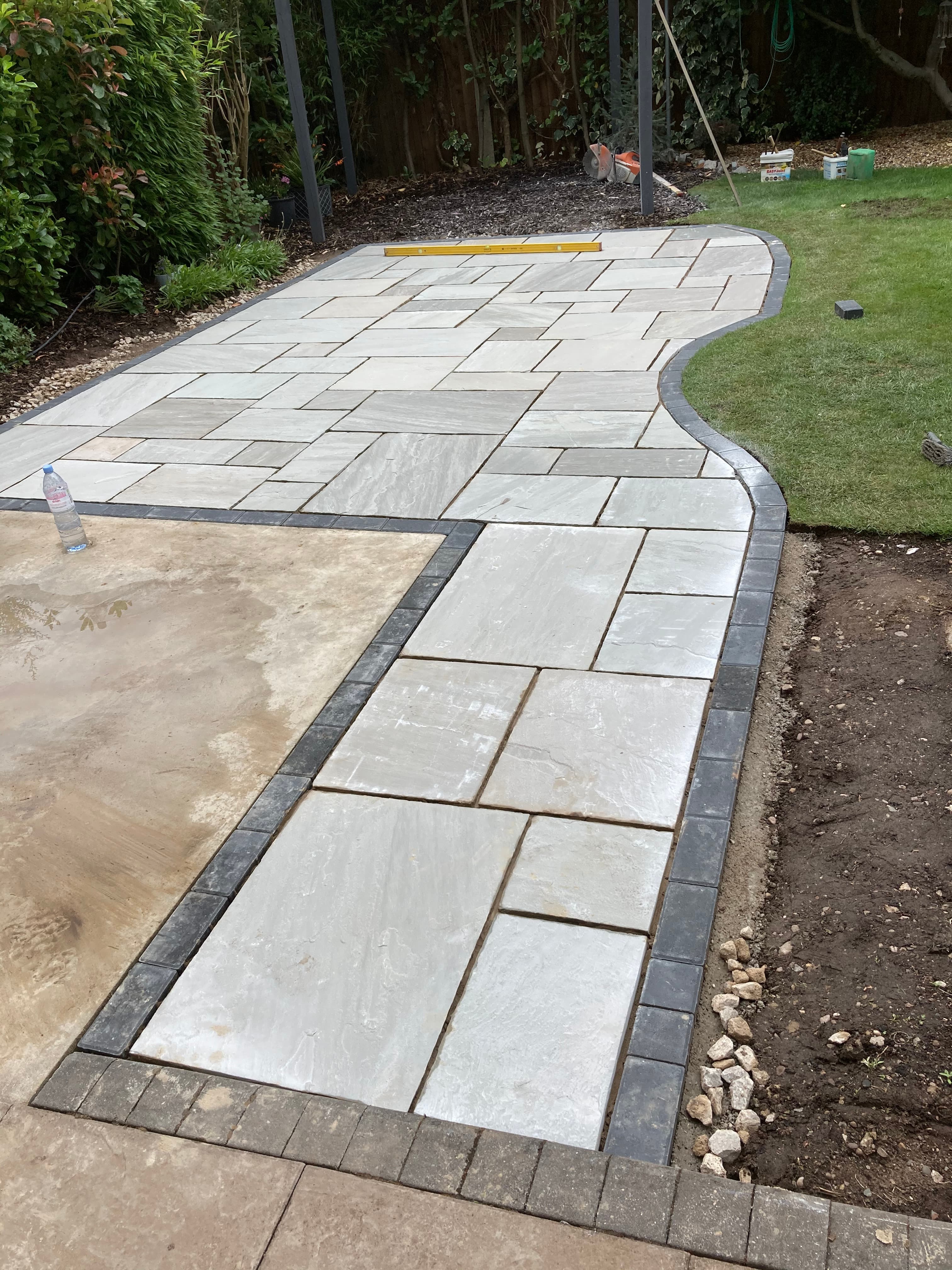 Completed patio viewed from the house showing the hot tub surround