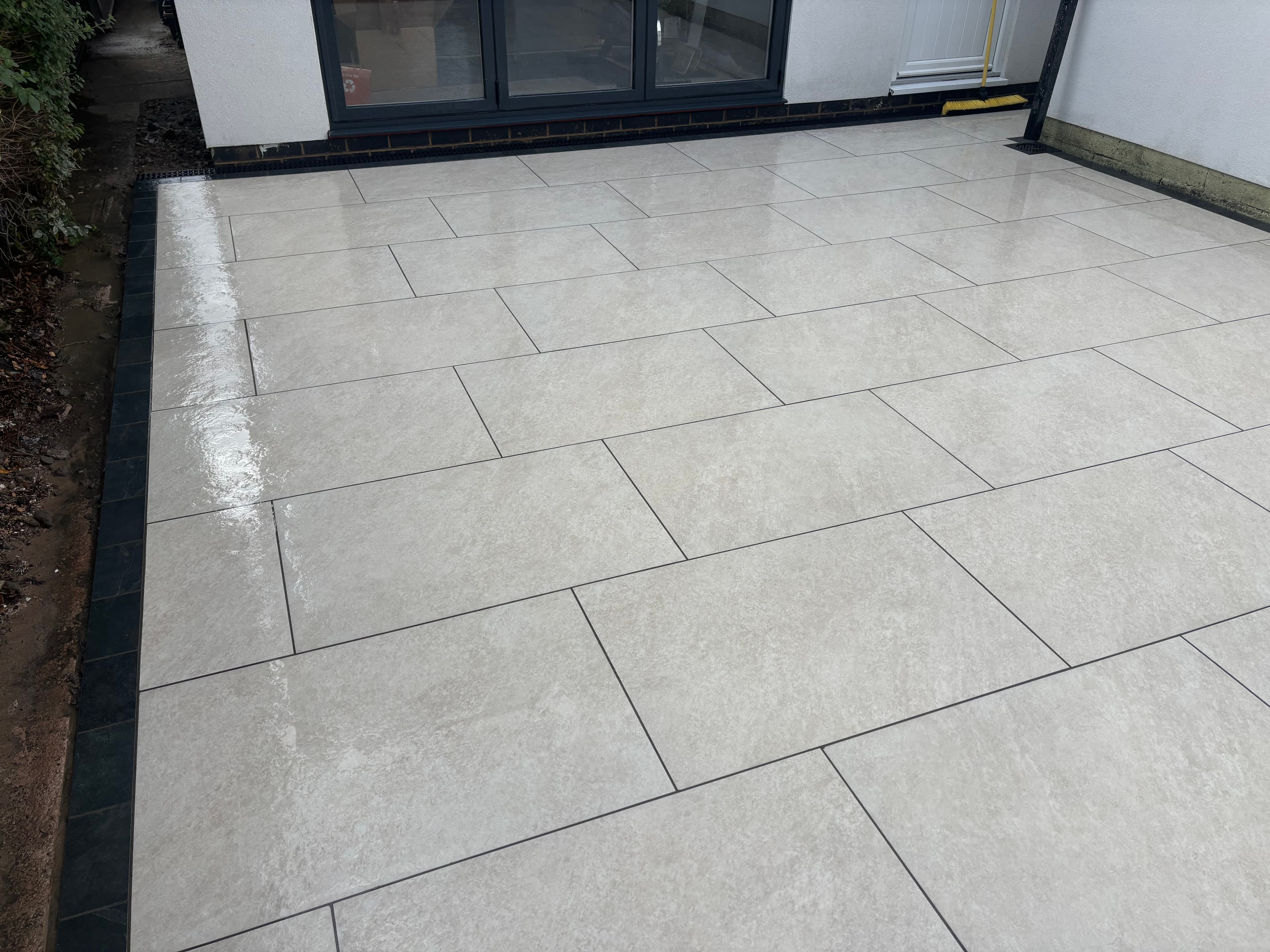 Porcelain slabs laid with precise jointing and level finish throughout