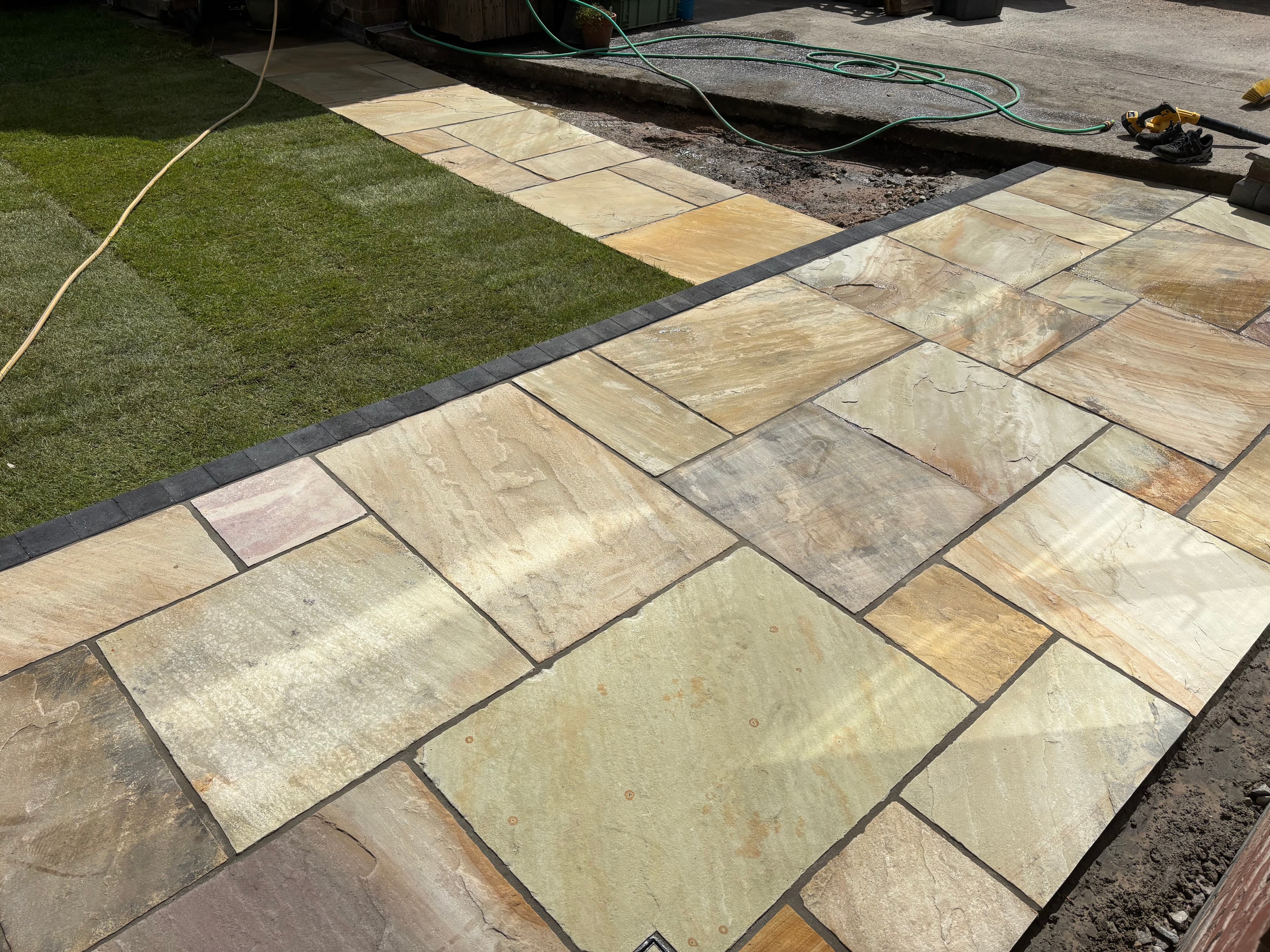 Sandstone path laid alongside the new smaller patio area