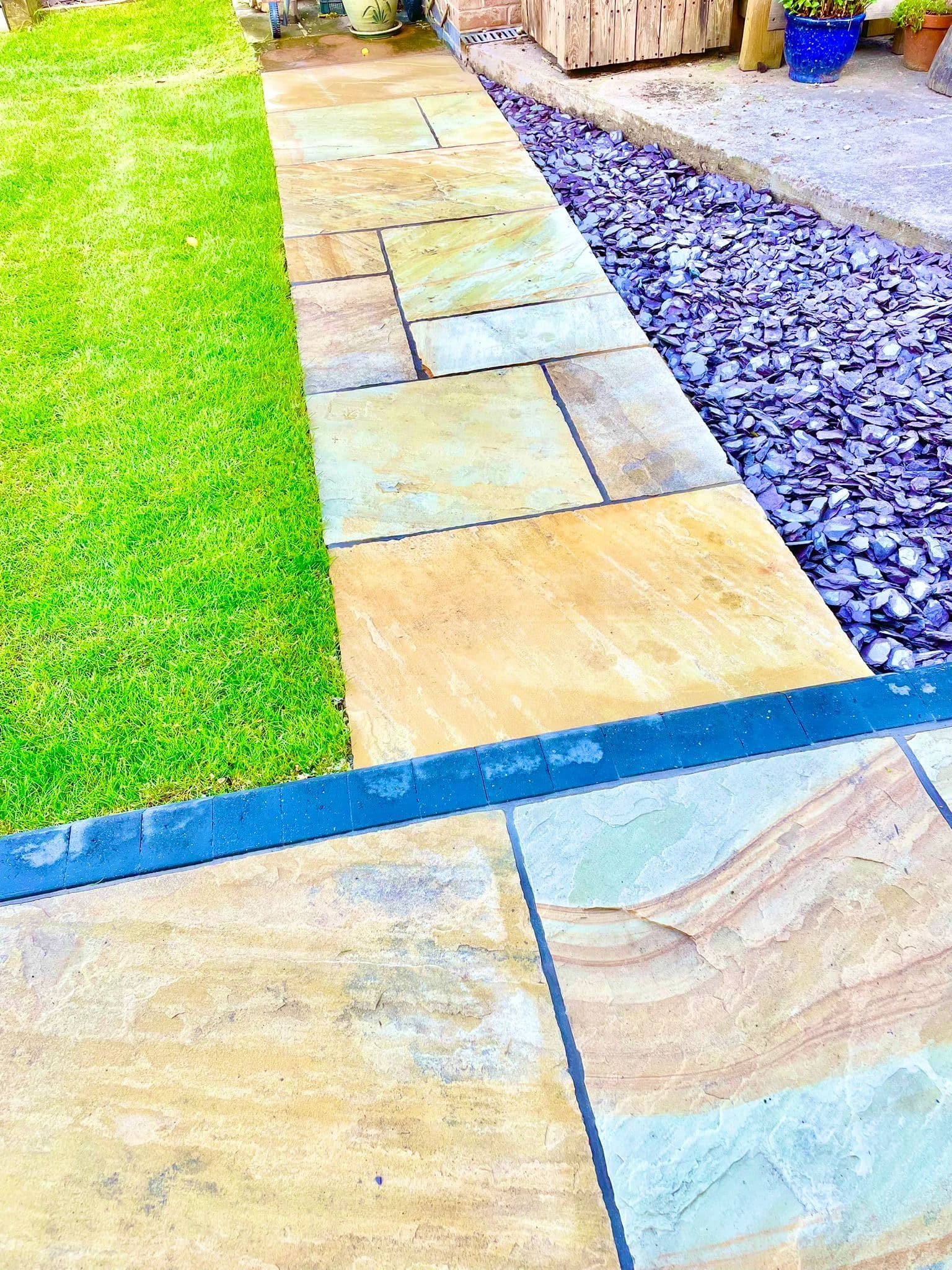 Close-up of Indian sandstone fossil patio pack with neat jointing