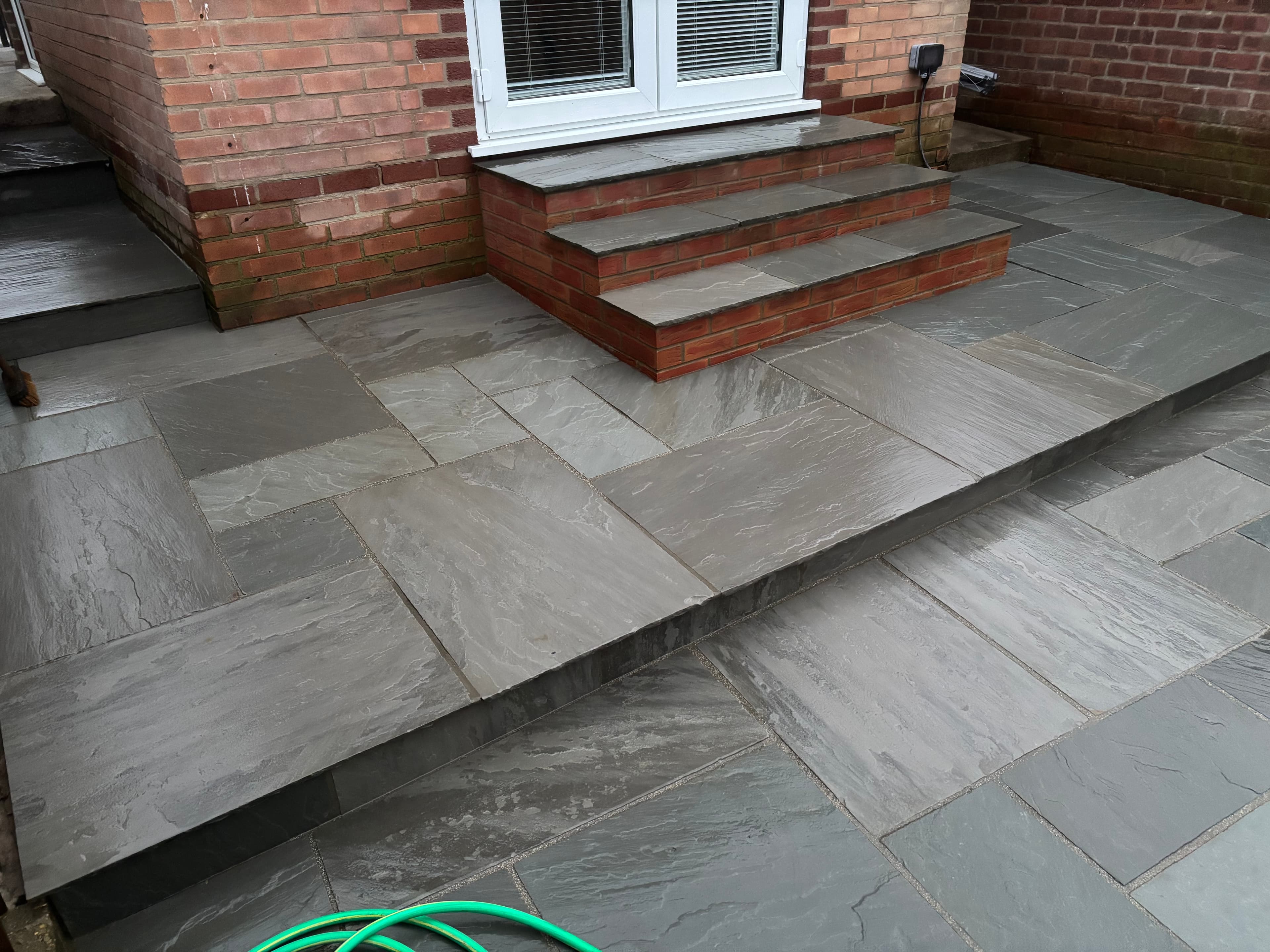 Overhead view of the completed sandstone patio and path layout