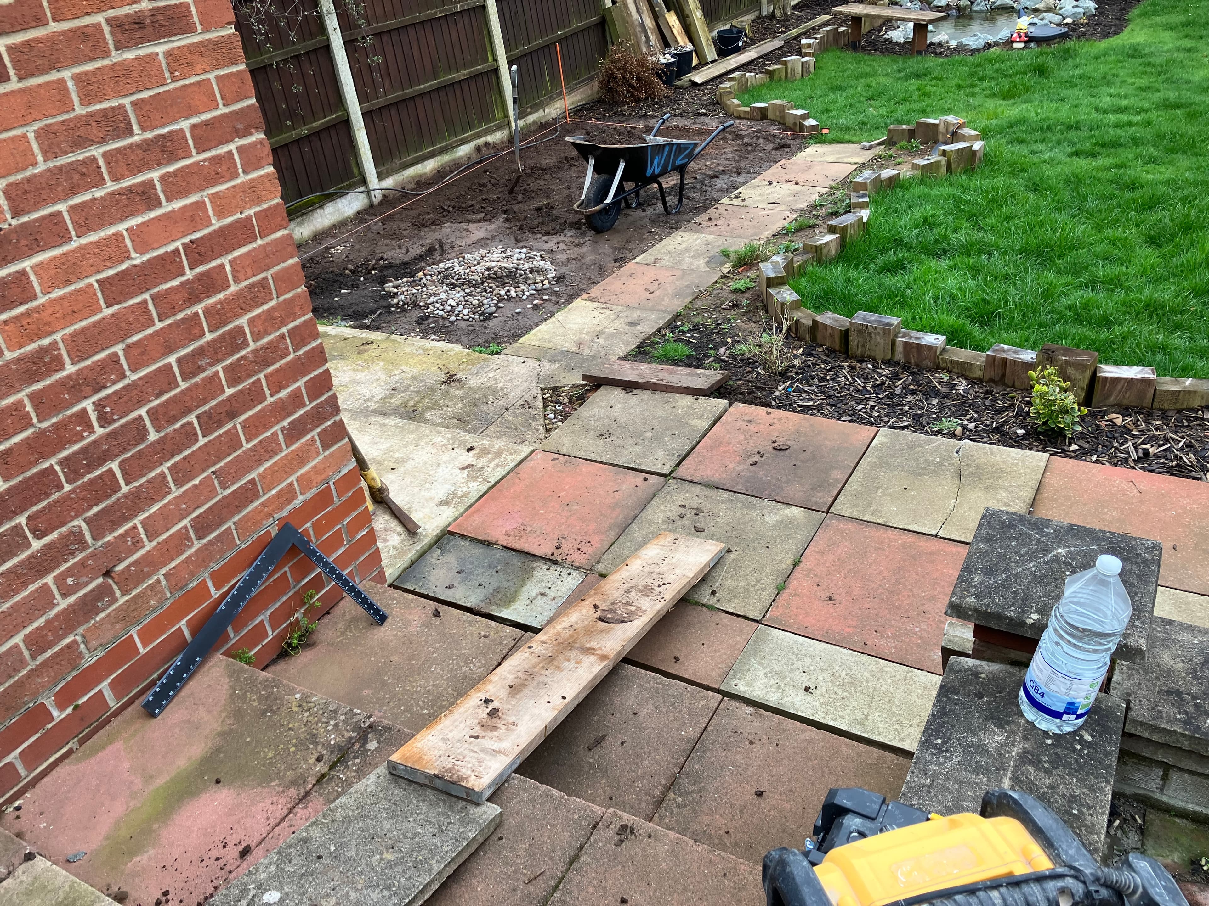 Natural stone steps connecting the upper and lower patio levels