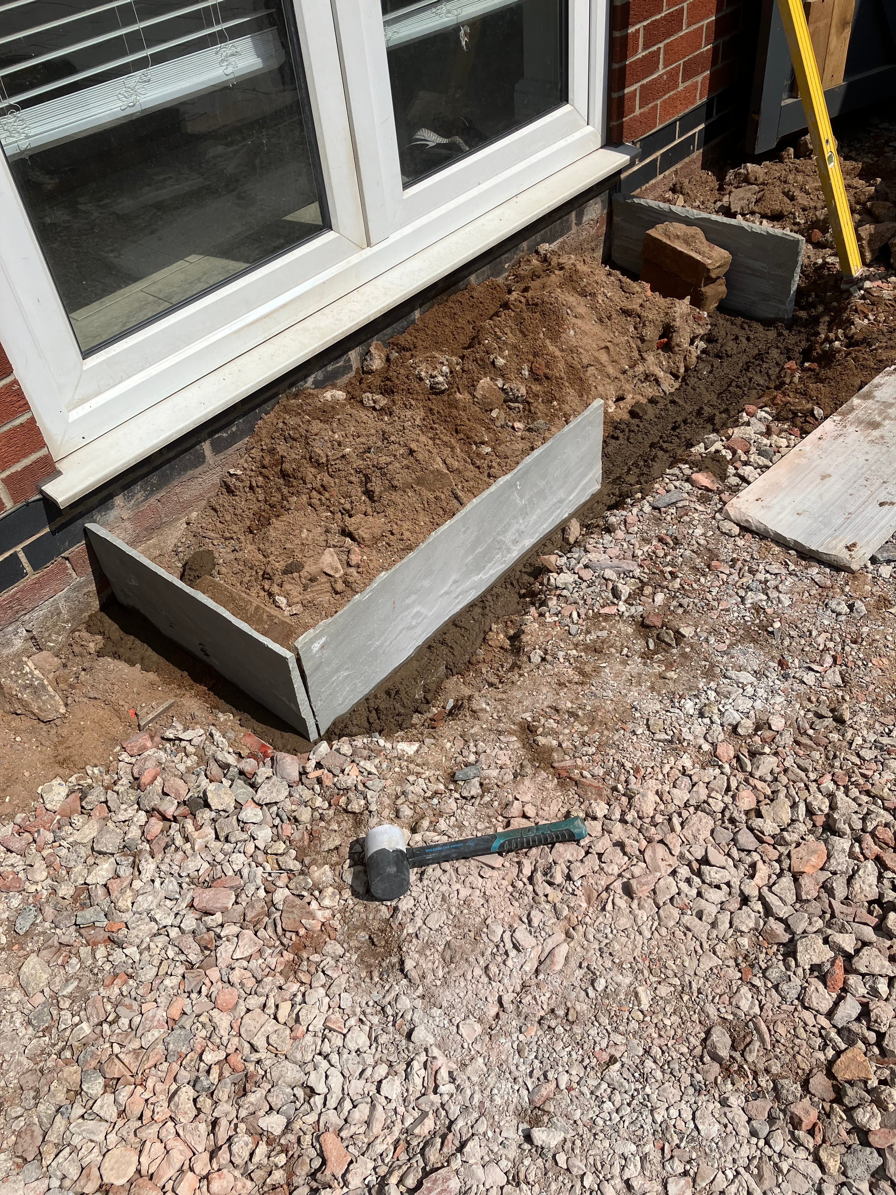 Timber railway sleeper raised planter built alongside the patio steps