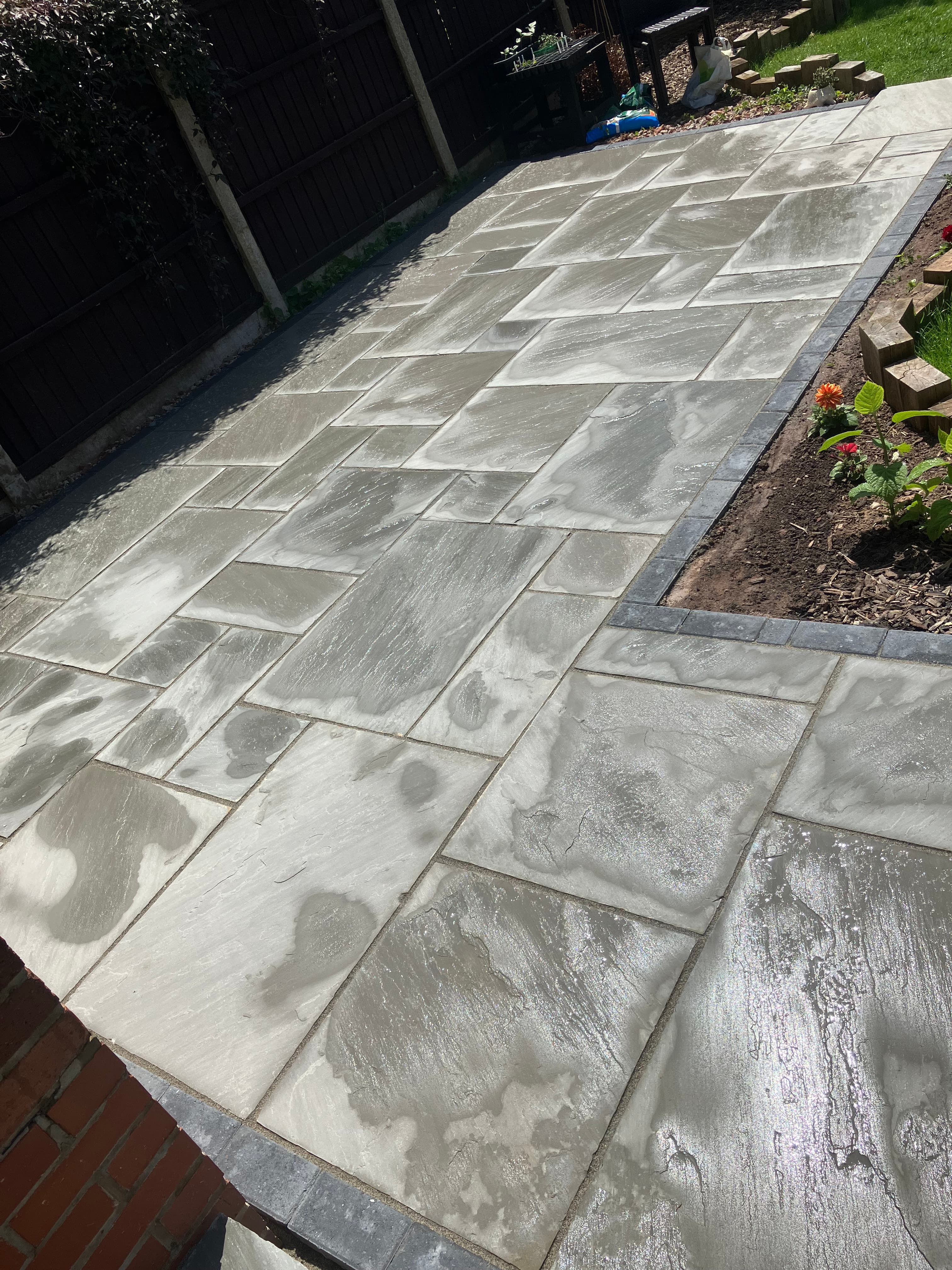 Completed lower patio area with granite edging and sleeper planter in Swadlincote