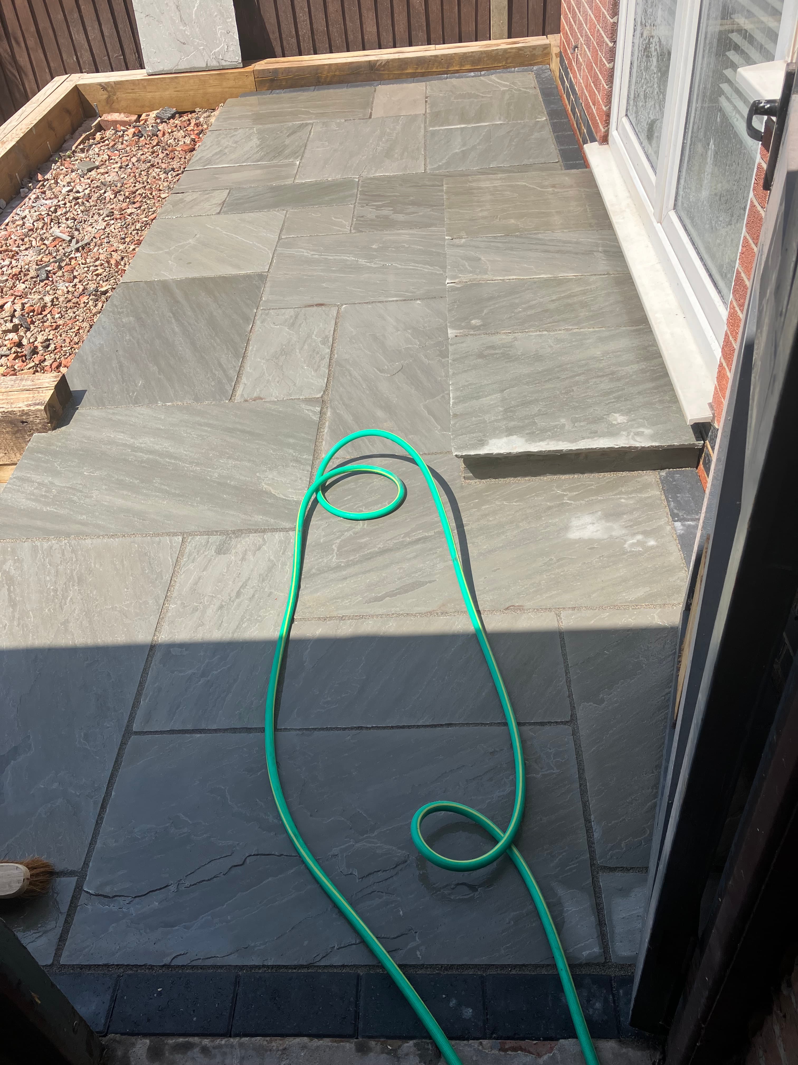 Close-up of natural stone slabs with neat jointing on the lower patio