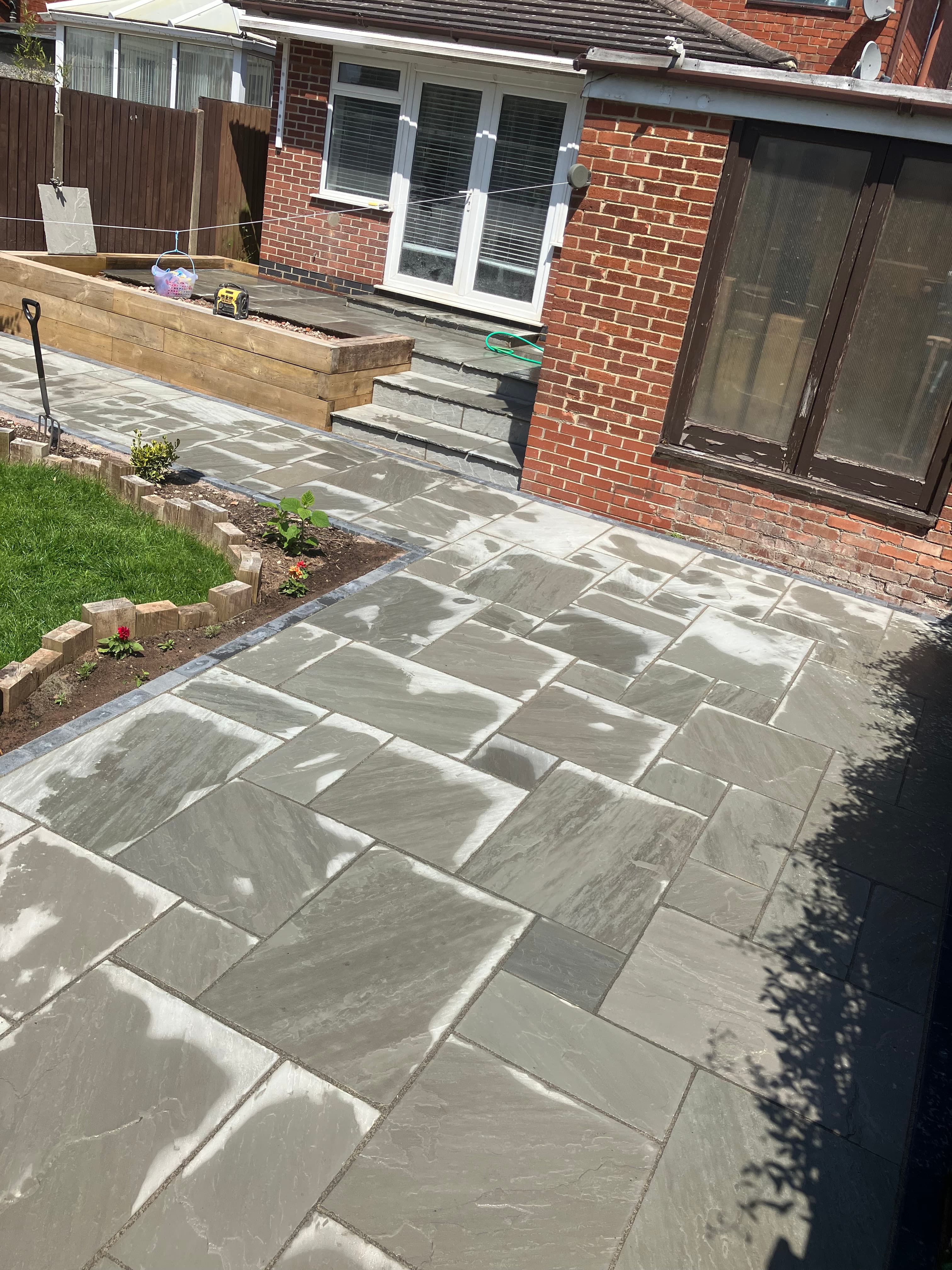 Full view of the completed patio and sleeper installation in Swadlincote